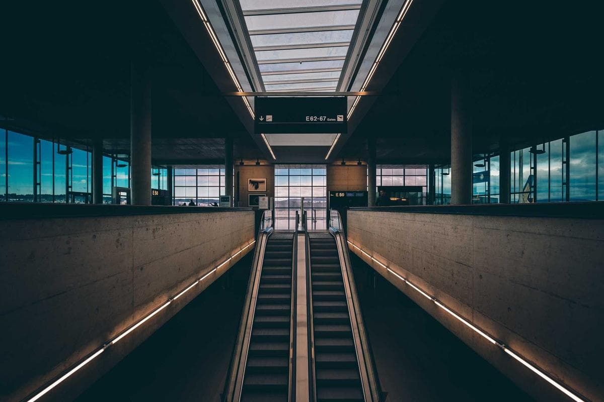 Escalators inside a modern transit hall