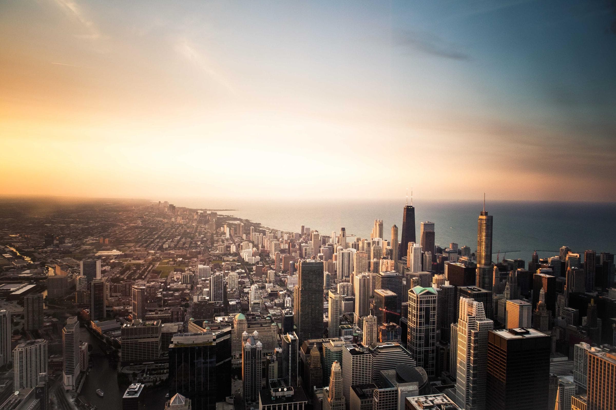 Aerial view of a city skyline at sunset